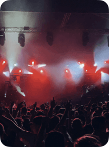 A concert crowd under red lights, representing a remembered night out